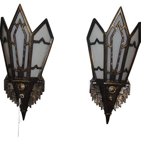 Pair of art deco bronze and opaline glass wall sconces. Art Deco Wall Sconces - Bronze with Glass Panels from sherlocksantiquelights on Ruby Lane