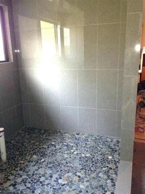 The shower is a sacred space for many of us, and a plain white plastic floor just won't cut it for some. Image result for walk in shower with pebble floor | Pebble ...