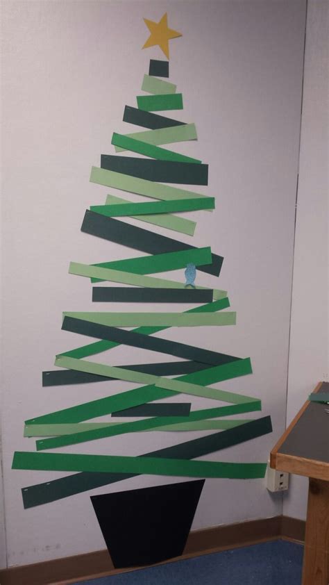 Christmas tree with construction paper strips, and a bird. - #christmas