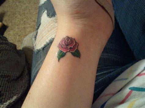 Traditional aqua flower tattoo design in upper back. 61 Small Rose Tattoos Designs for Men and Women
