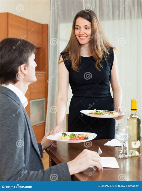 Girl Serving Dinner For Beloved Man Stock Photo Image Of