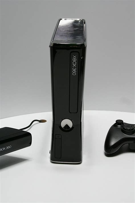 Xbox 360 Slim Launched By Microsoft Buzz Punching