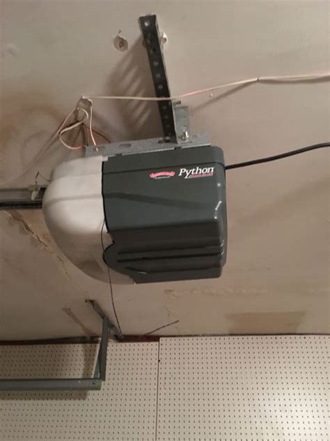 Garage door opener is in the fully open position and cannot be closed with a car remote, smart phone, or keypad. Python garage door opener with rail for Sale in San ...