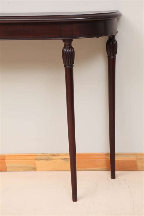 I would like to purchase a console table to put near the front door and decorate it. Tall Italian Mahogany Console Table at 1stdibs