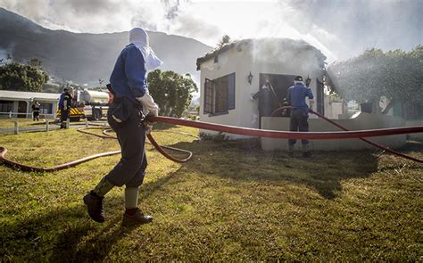 more help enlisted as simons town fire rages on