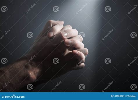 Hands Of A Prayer Light Shining On Praying Man S Hands Stock Image