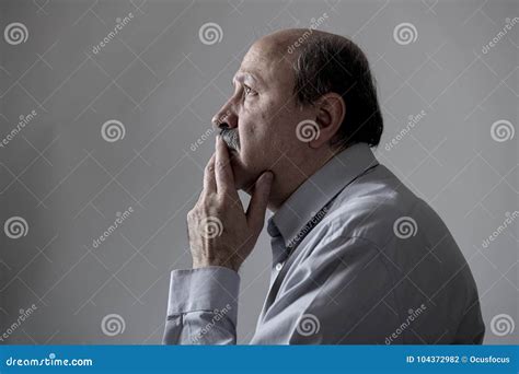 Head Portrait Of Senior Mature Old Man On His 60s Looking Sad And