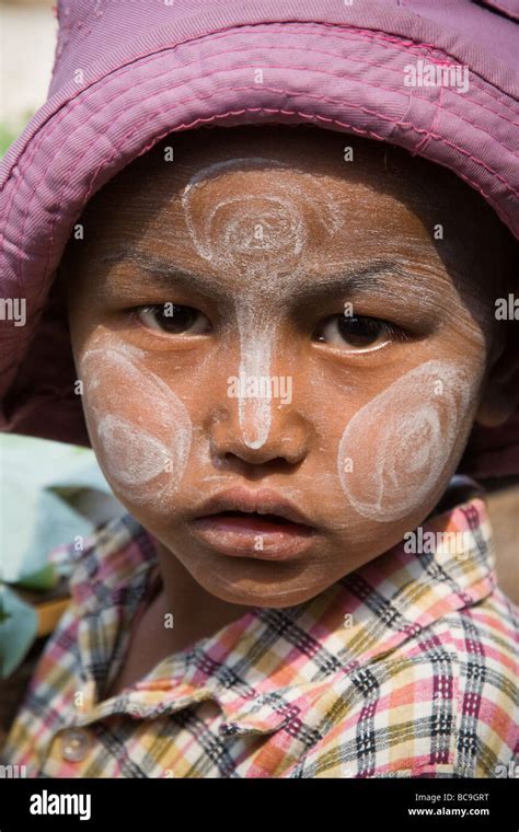 Portrait Of An Burmese Girl With Thanaka Paste In Her Face Stock Photo