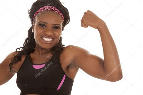 Woman Showing Arm Muscles Stock Photo By ©alanpoulson 13656957