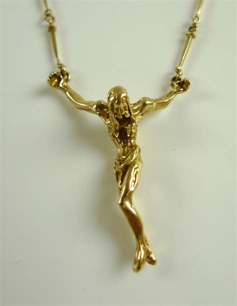 After Salvador Dali An 18ct Gold Crucifix Necklace After The Painting
