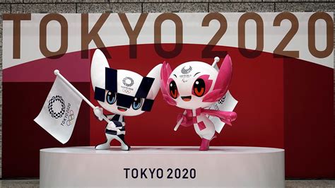 The tokyo 2020 olympic games mascot is styled with the ai (indigo blue) ichimatsu structure from the tokyo 2020 games. Mascot statues celebrate 100 days to Tokyo Olympics