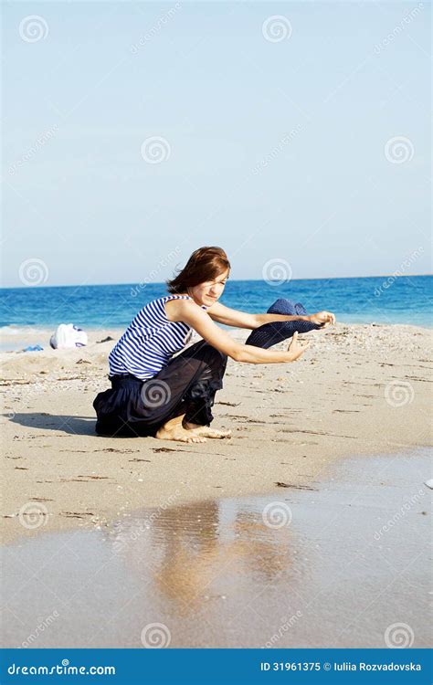 Beautiful Tanned Woman Resting On The Beach In Summer Day Stock Image