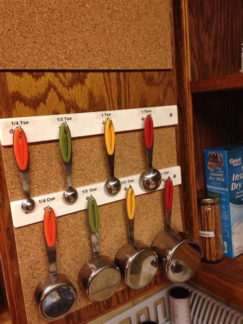 Maybe you would like to learn more about one of these? Make a measuring cup holder for the inside of your cabinet ...