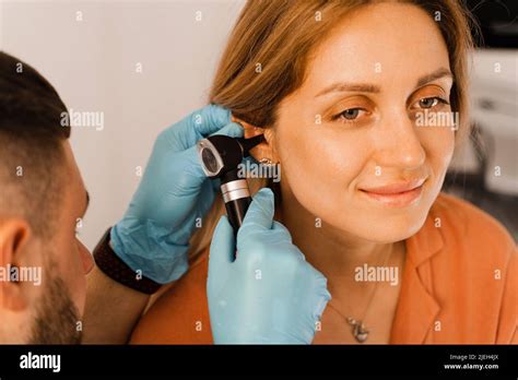 Close Up Examination Of Womans Ear With Otoscope Otoscopy Visit To