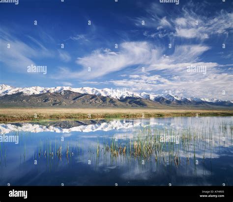 Nevada Usa Cirrus Clouds Above Ruby Mountains And Slough Along Franklin