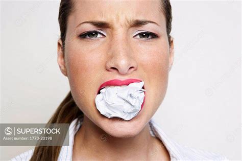 Woman With Paper Ball Stuffed Into Her Mouth Superstock