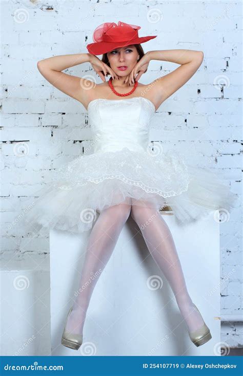 Beautiful Long Legged Bride In Wedding Dress And White Stockings Posing