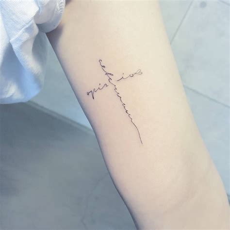 Small cross tattoo has always been popular with the inking crowd. Pin em tattoo
