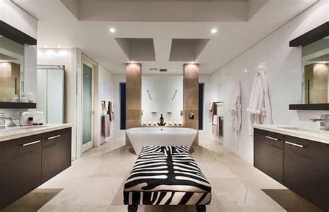 Try pairing multiple patterns in the same color palette for a fun yet cohesive look. Animal prints for luxury bathrooms