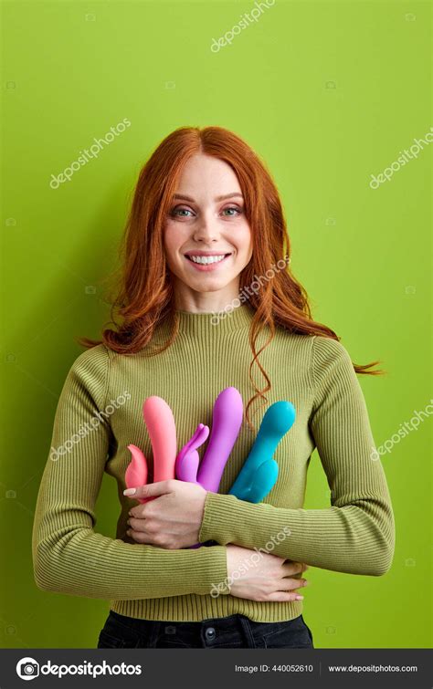 Smiling Redhead Woman Gets Pleasure Using Sex Toys Vibrator To Satisfy