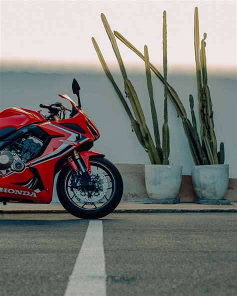 Download Exhilarating Speed Honda Motorcycle In Action Wallpaper