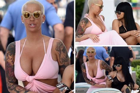 Amber Rose Squeezes Her Cleavage Into Flesh Flashing Beach Wrap And Flaunts Her Curves On Miami