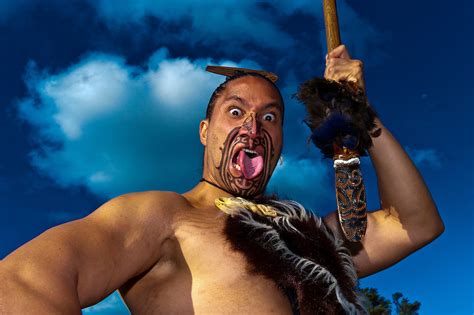 A Maori Warrior With A Ta Moko Facial Tattoo Performs A