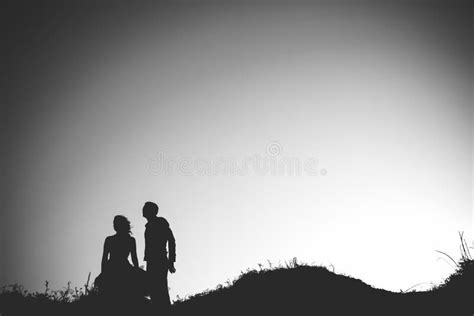 Bride And Groom Backlit In A Sunset On The Beach Stock Image Image Of