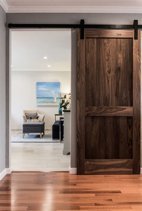 Modern beach house is located on the outer banks of north carolina. Custom barn door and hardware set a relaxed and updated rustic style in this beach home ...