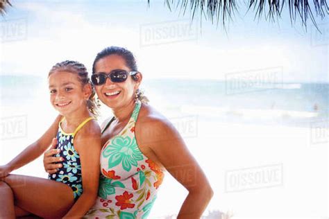 Smiling Mother And Daughter Enjoying Tropical Beach Stock Photo