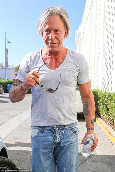 Reversing In Age Mickey Rourke Shows Off Toned Figure In A Tight T Shirt And Distressed Jeans