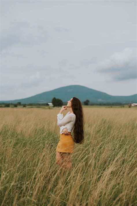 Person Woman Standing In The Middle Of Grass Field Nature Image Free Photo