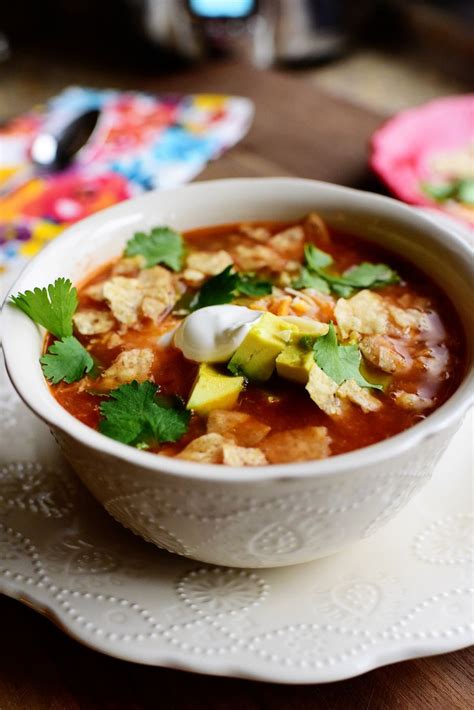 Place the chicken in the slow cooker. pioneer woman taco soup
