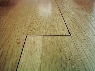 For very small gaps, wood glue and sawdust works well, with a little spit if necessary for good luck. How To Choose and Use Fillers on Wood Floors