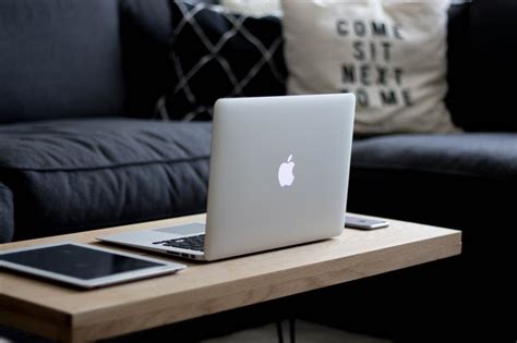 Free Photo Coffee Table With Macbook Ipad And Iphone One In The