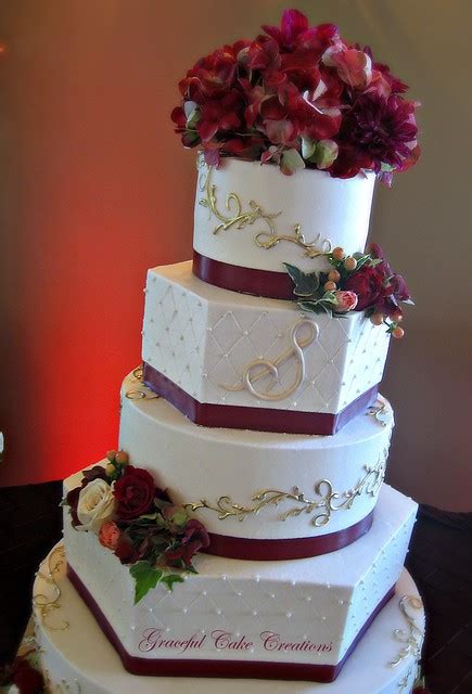 Mother and daughter decorating cakes together. Elegant Ivory Buttercream Wedding Cake with Burgundy and ...