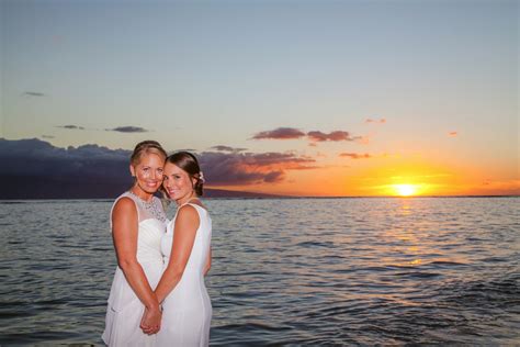 Newly Married Lesbian Couple Smiling During Beach Wedding Photography