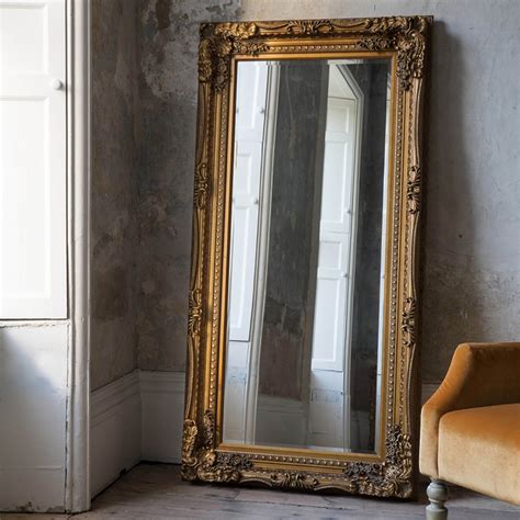 Modern arched shape framed gold standing mirror full length floor mirror key features: Carved Louis Gold Antique French Style Leaner Mirror | HomesDirect365