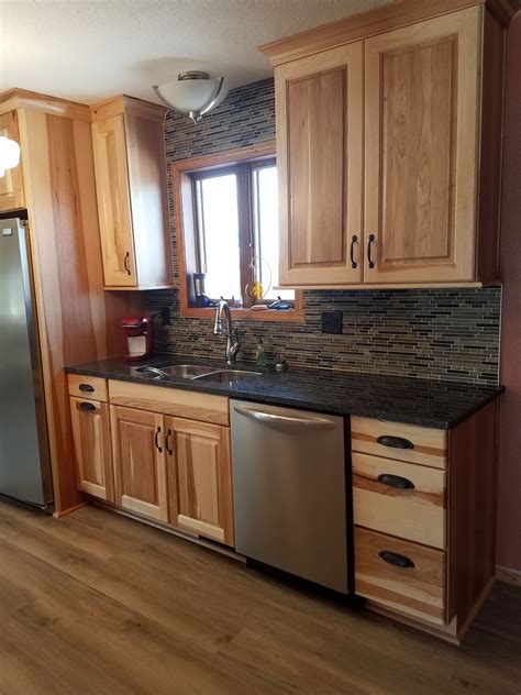 Natural Hickory Cabinets With Silver Pearl Granite Countertops