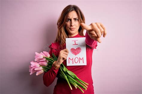 Beautiful Brunette Woman Holding Love Mom Message And Tulips Celebrating Mothers Day Pointing