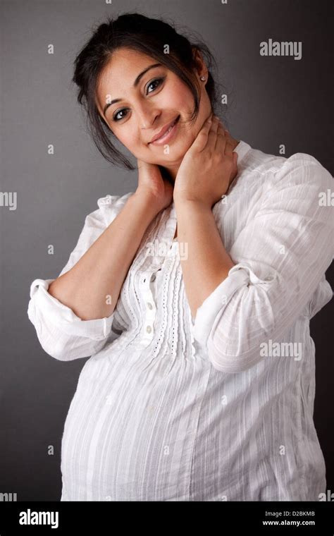 Portrait Of A Smiling Pregnant East Indian Woman Stock Photo Alamy