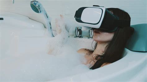 Girl Take Bath Full Of Foam In Bathroom With Virtual Reality Glasses Smile Stock Video Video