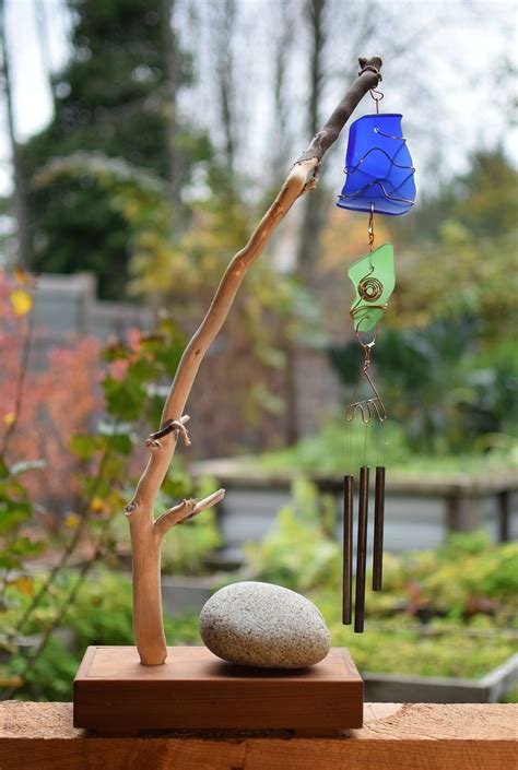Instead of using them to craft necklaces and bracelets, turn them into wind chimes to add a splash of color to your backyard. Wind Chime Suncatcher Freestanding Driftwood Sea Glass ...