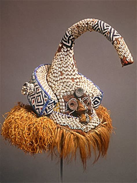 Embellished with cowrie shells, beads, seed pods, copper sheeting, goatskin, and hair, bwoom is one of three types of royal kuba masks, all of which are treated as embodiments of nature spirits (mingesh). Kuba Mukenga mask - Rand African Art