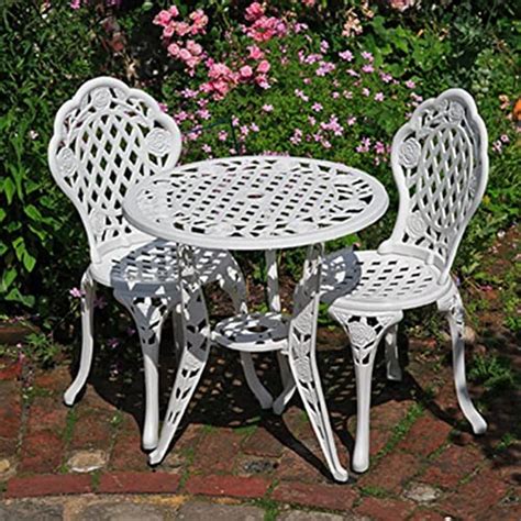 Both the painted metal bistro table ($188) and the painted metal bistro chair set collapse for easy storage. French Ornate Cream Wrought Iron Metal Garden Table and ...