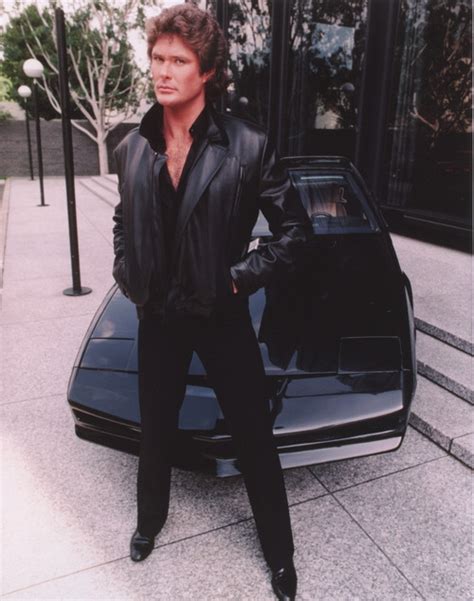 David Hasselhoff Standing In Black Leather Jacket With Black Pants And