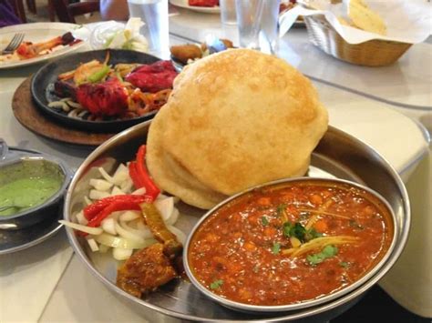 Chole bhature is a combination of chickpea (chole) curry served with deep fried puffed puries called bhature. Chole Bhature