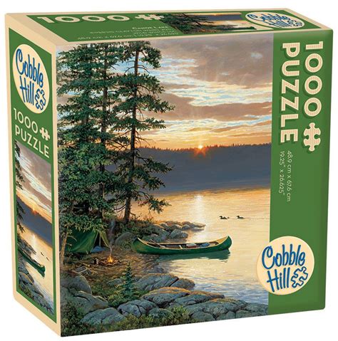 A Puzzle Box With An Image Of A Lake And Canoes On The Shore At Sunset