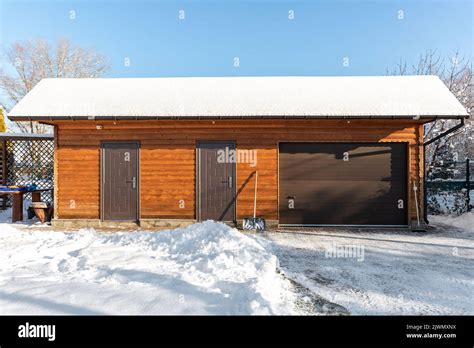 Facade front wall view closed door ATV home garage workshop clutter