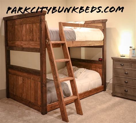 1 is a perspective view of a bunk bed with perpendicular bunks showing my new design; Silver Summit Parallel Custom Bunk Bed